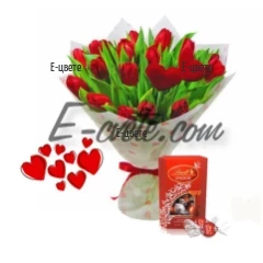 Romantic bouquet of red tulips and chocolates.