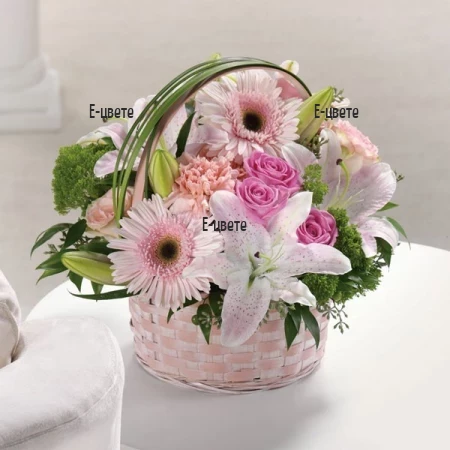 Send a basket with pink flowers for the beloved one.