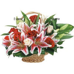 Send a flower basket with lilies, roses and greenery.