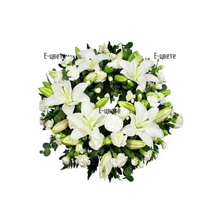 Send funeral flowers - funeral wreath of lilies and carnations