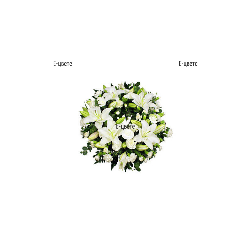Send funeral flowers - funeral wreath of lilies and carnations