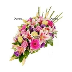 Send Funeral  arrangement of various flowers