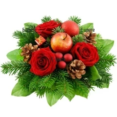 Flower delivery. A bouquet - Christmas decoration, send by a courier.