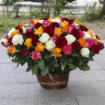 Send a basket with flowers - colourful roses.