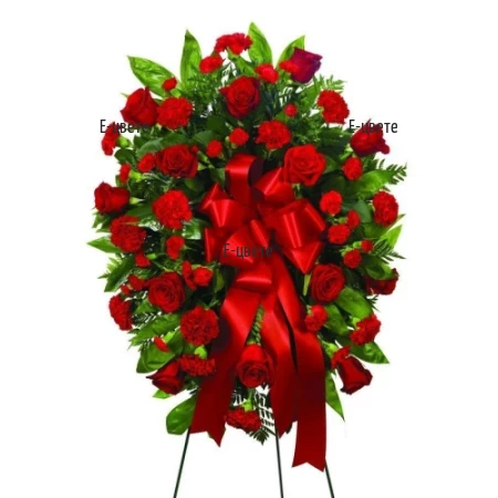 Send funeral wreath in red hues