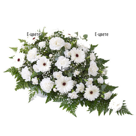 Send funeral arrangement with white flowers