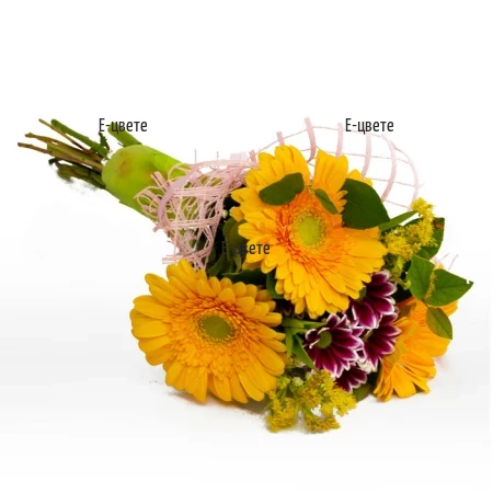A bouquet of yellow gerberas and greenery.