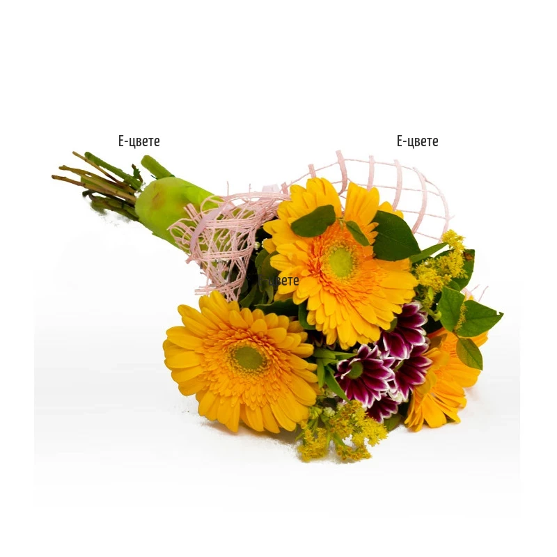 A bouquet of yellow gerberas and greenery.