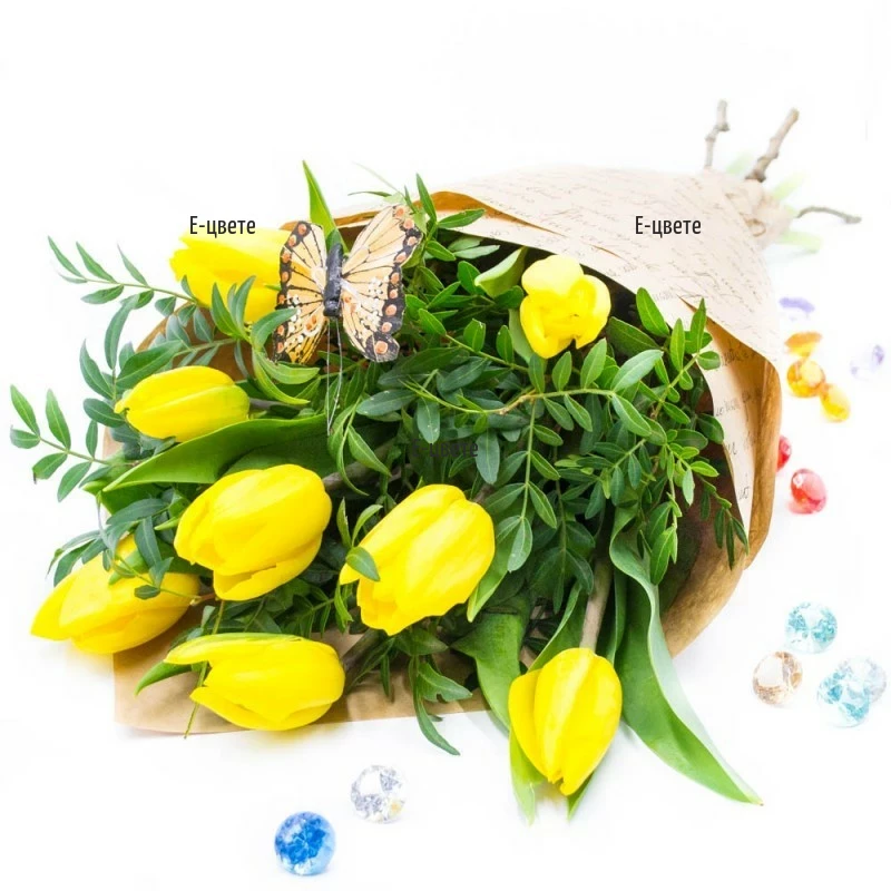 Send a bouquet of yellow tulips and greenery.