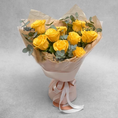 Flower delivery - a bouquet of yellow roses and greenery.