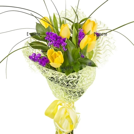 Send a bouquet of yellow tulips and statice.