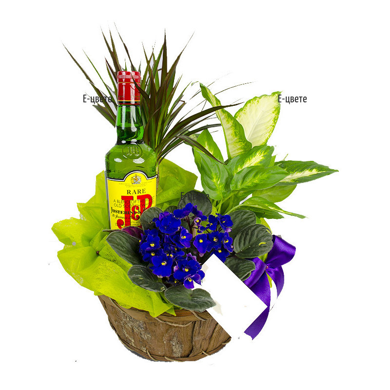 Online order for gift basket with branded alcohol and flowers.