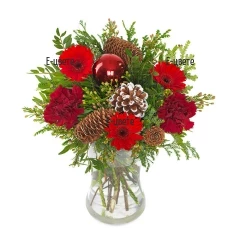 Bouquet of red flowers and christmas decoration.