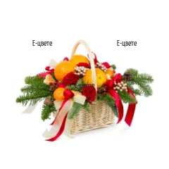 Send a basket with flowers and Christmas gifts.