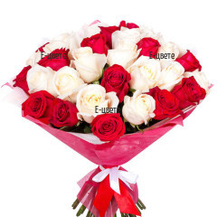 Send a luxurious bouquet of white and red roses.