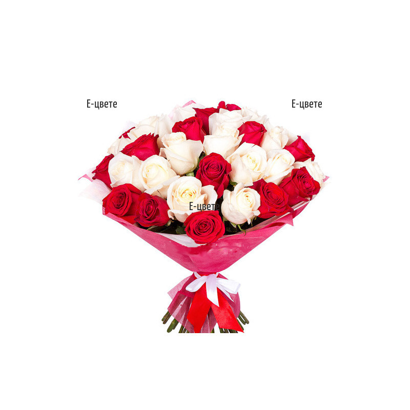 Send a luxurious bouquet of white and red roses.