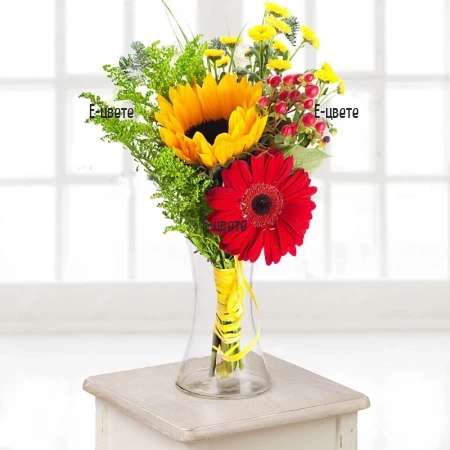Modern summer bouquet of sunflowers and gerberas