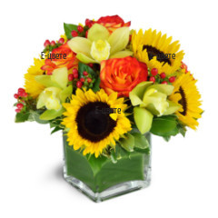 Send an arrangement of flowers on piaflora in glass cube.