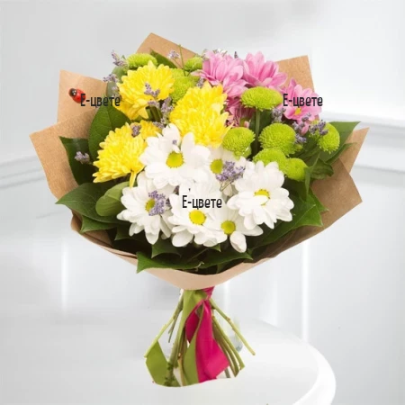 Send a bouquet of colourful  chrysanthemums and greenery.