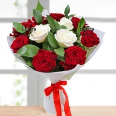 Tender hug - a bouquet of red and white roses with greenary.