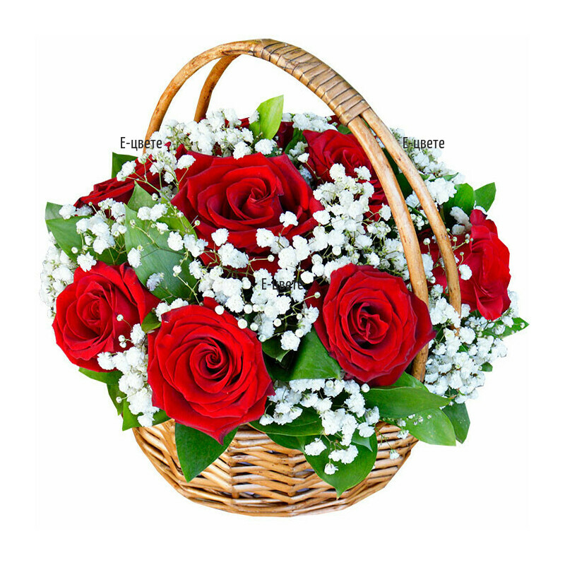 Basket with red roses and gypsophila