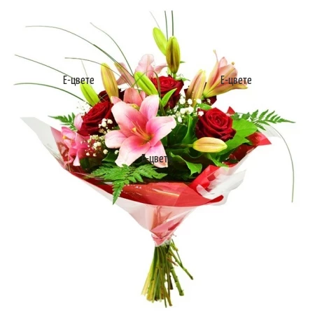 A beautiful and romantic bouquet of lilies roses and greenery