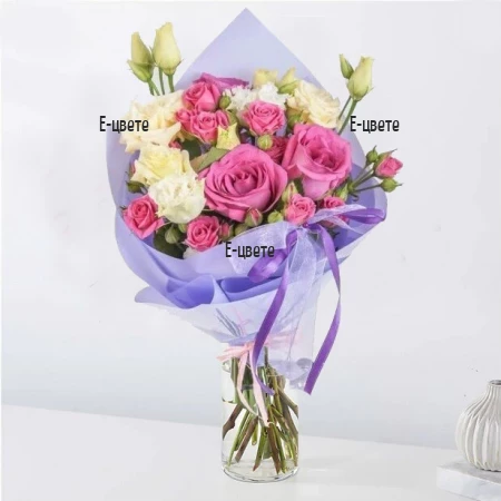 A delicate bouquet of roses and eustomas
