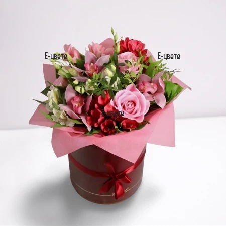 Colorful flowers in a round box