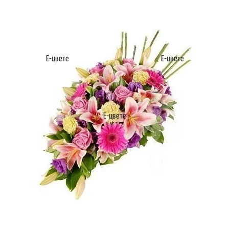 Send Funeral  arrangement of various flowers