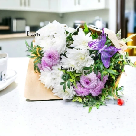 Send a bouquet of white chrysanthemums and purple decoration.
