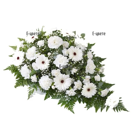 Send funeral arrangement with white flowers
