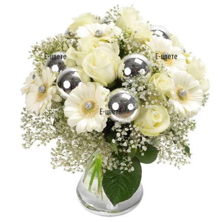 Send Christmas bouquet of white flowers and greenery.