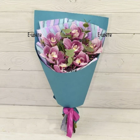 Send a bouquet of Cymbidium orchid and greenery.