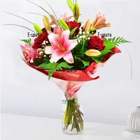 A beautiful and romantic bouquet of lilies roses and greenery