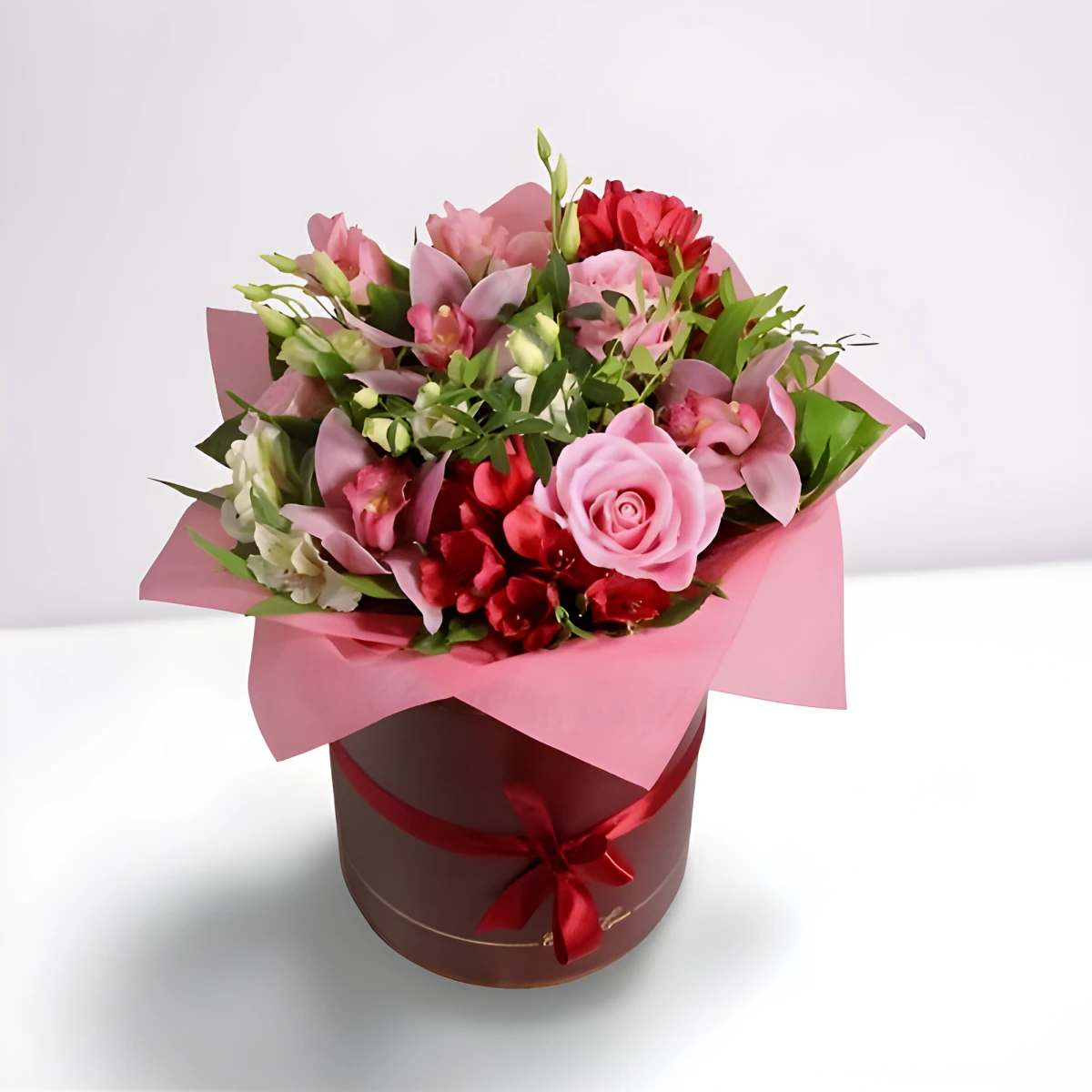 Colorful flowers in a round box