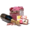 Arrangement of roses, chocolates and sparkling wine